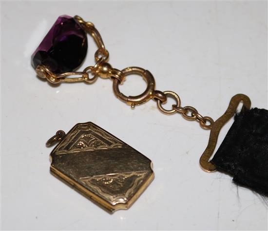 Gold and amethyst swivel fob and a gold locket